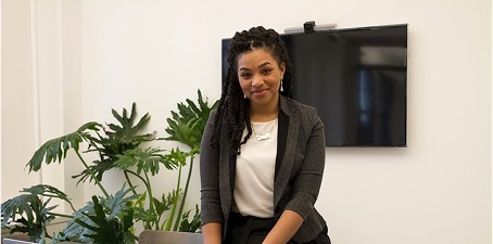 woman in suit smiling 
